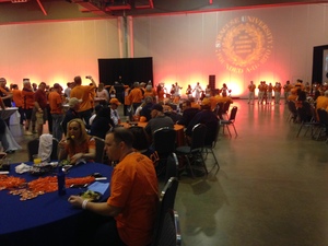 Syracuse fans gather inside the NRG Center in Houston for a pre-game celebration before the SU men's basketball team plays the University of Virginia in the Final Four.
