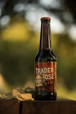 Trader Joe's Dark Beer is a pilsner brew Mexico, making it a fine pair with chips and guacamole.